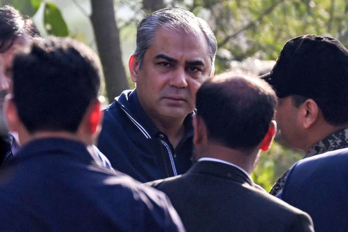 Pakistan's Federal Interior Minister, Mr  Mohsin Naqvi (centre) visiting the site of a suicide blast in Islamabad on Nov 11.