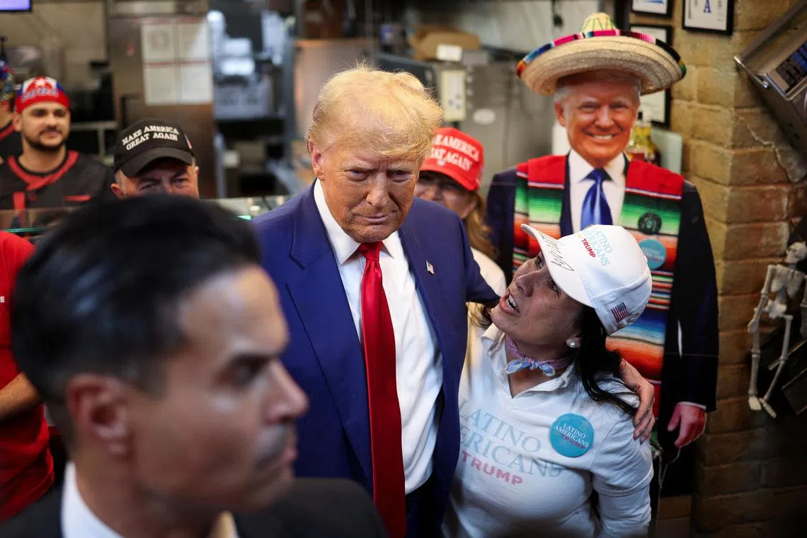 Republican presidential nominee and former U.S. President Donald Trump makes a stop at Havana Express Cuban restaurant, in Las Vegas, Nevada, U.S. October 24, 2024. REUTERS/Carlos Barria REFILE - QUALITY REPEAT     TPX IMAGES OF THE DAY     