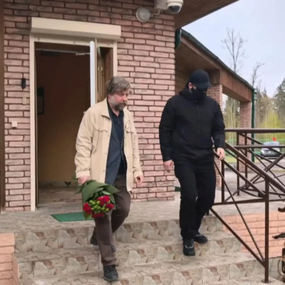 Russian archaeologist Alexander Butyagin walks after being released by Poland as part of a prisoner swap at the Pererov-Bialowieza border checkpoint in the Brest region, Belarus, April 28, 2026, in this still image taken from video. Belteleradiocompany/Handout via REUTERS