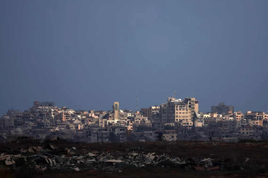 FILE PHOTO: A general view of damaged buildings in Gaza, amid the Israel-Hamas conflict, near the Israel-Gaza border, as seen from Israel, August 23, 2024. REUTERS/Florion Goga/File Photo