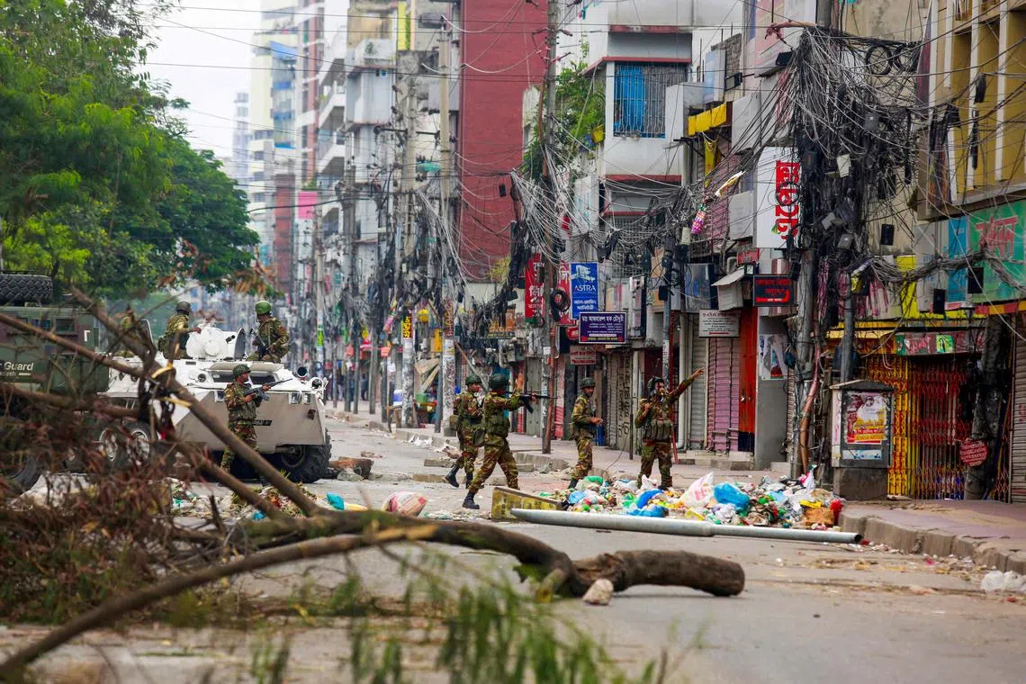Bangladeshi soldiers patrolling the streets to disperse protesters, in Dhaka, on July 20.