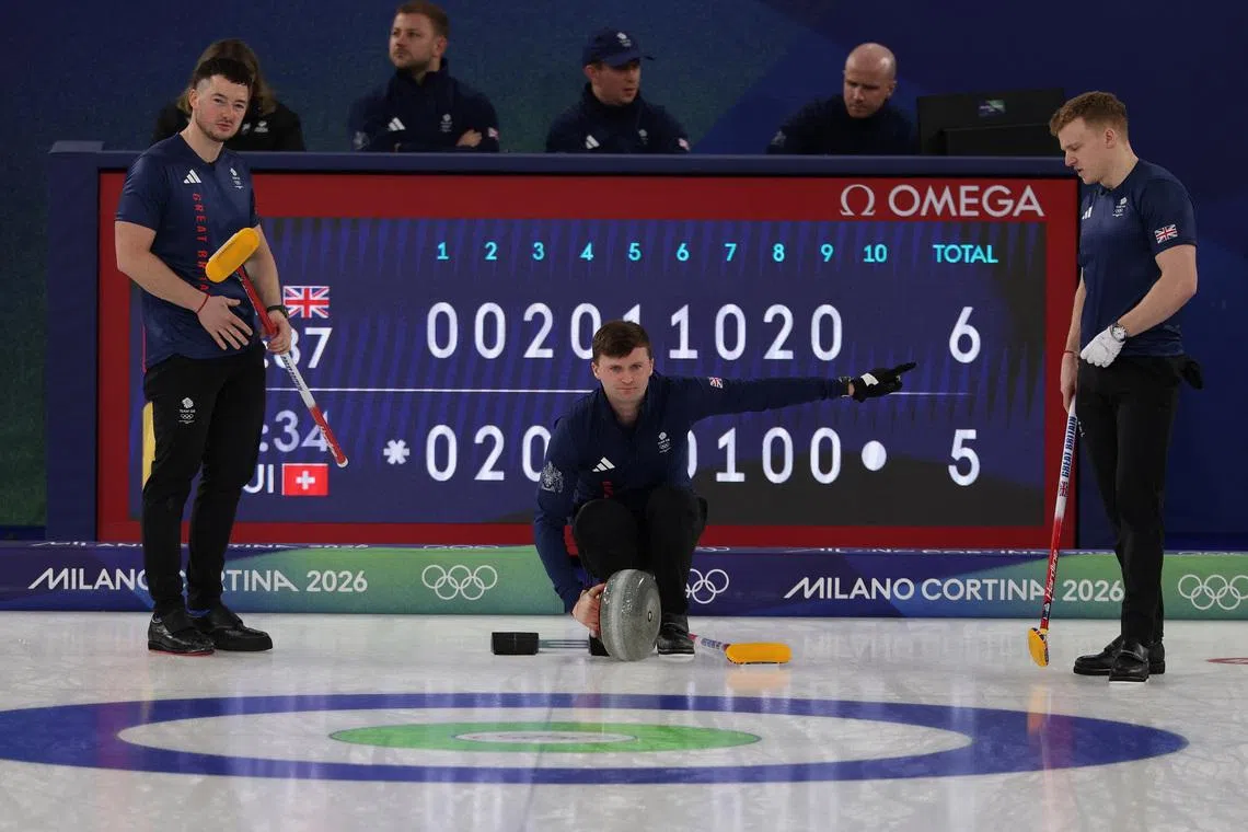 Milano Cortina 2026 Olympics - Curling - Men's Semi-final - Great Britain vs Switzerland - Cortina Curling Olympic Stadium, Cortina d'Ampezzo, Italy - February 19, 2026. Bruce Mouat of Britain, Hammy McMillan of Britain and Bobby Lammie of Britain during their match against Switzerland REUTERS/Issei Kato