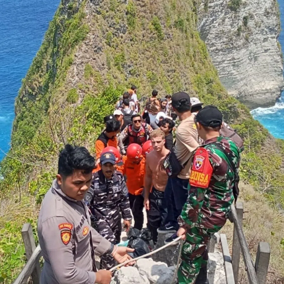 The woman was brought to the top of the cliff after a 1 1/2-hour operation, but was pronounced dead at the clinic.