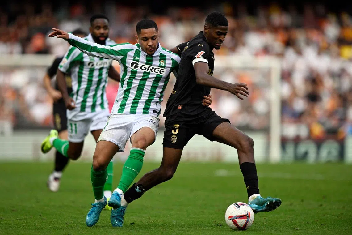 Valencia's Cristhian Mosquera (right) in action with  Vitor Roque of Real Betis.