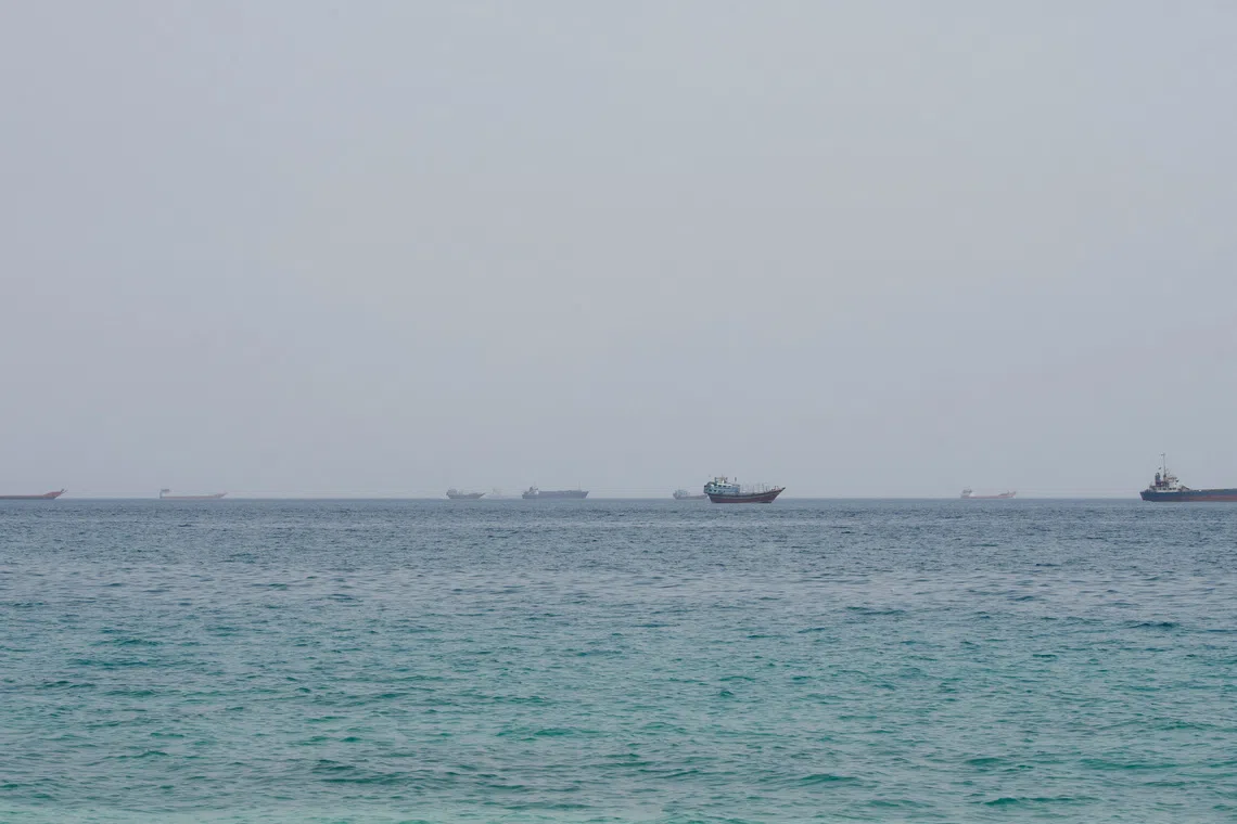 FILE PHOTO: Vessels near the Strait of Hormuz, as seen from Musandam, Oman, August 10, 2026. REUTERS/Stringer/File Photo
