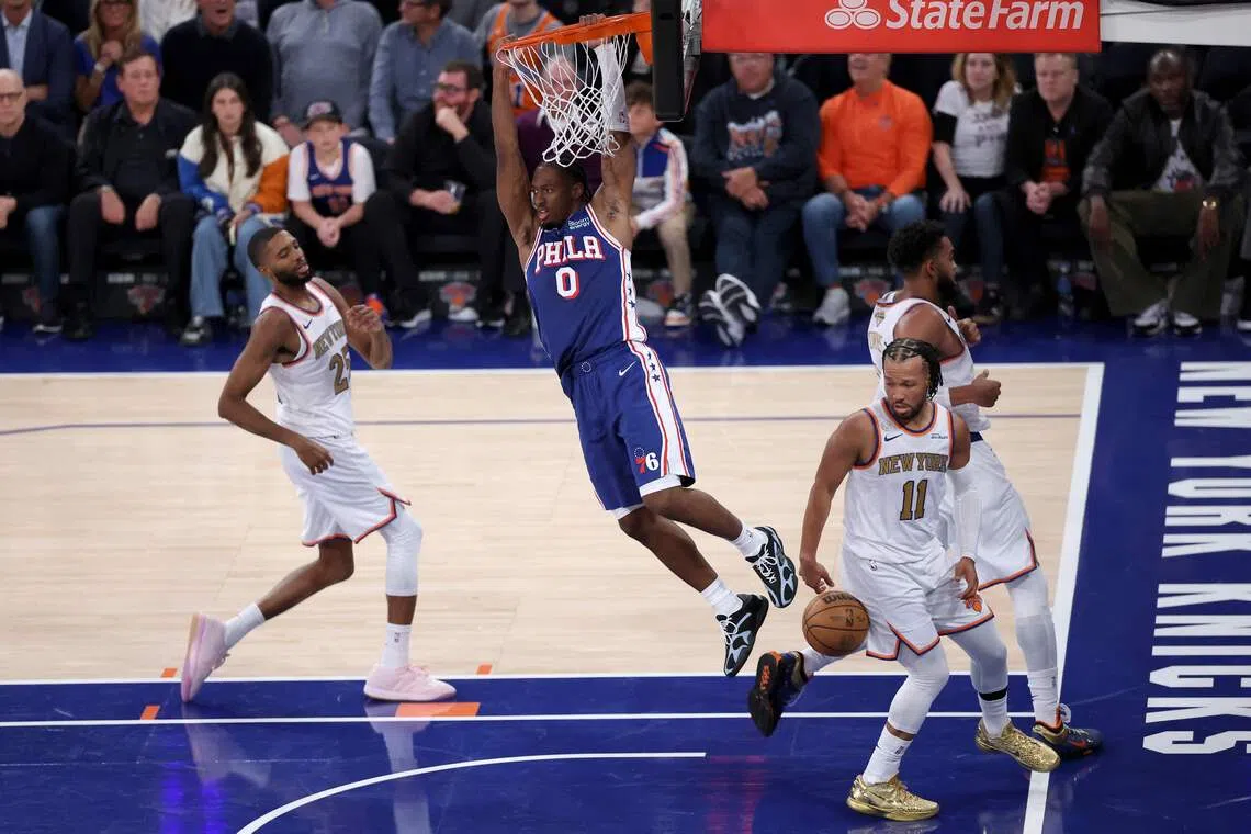 Tyrese Maxey (in blue) of the Philadelphia 76ers scored a game-high 28 points as the Sixers beat defending NBA champions New York Knicks.