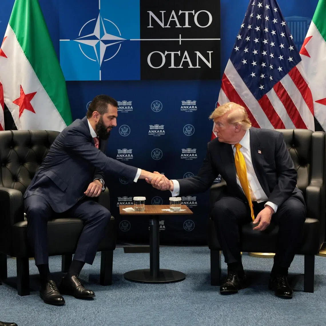 US President Donald Trump (right) shaking hands with Syrian President Ahmed al-Sharaa at a NATO leaders summit in Ankara, Turkey, on July 8.