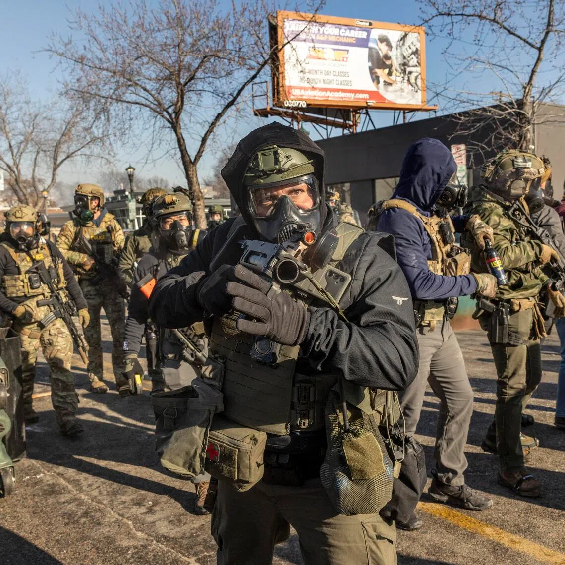 Federal agents confronting protesters in Minneapolis on Jan 24.