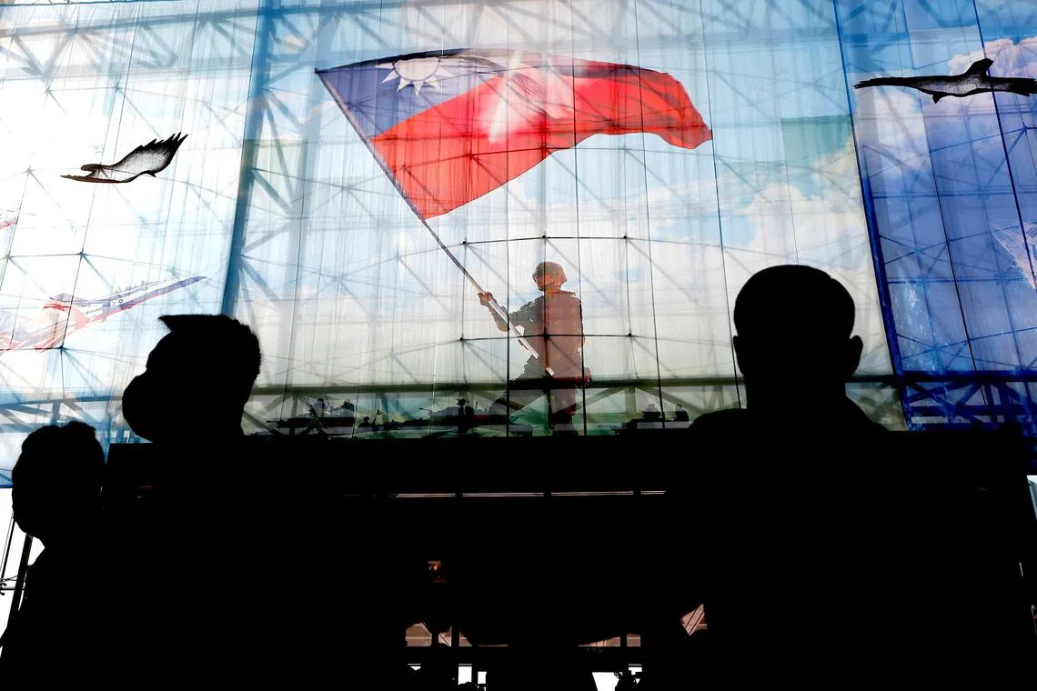 FILE PHOTO: Taiwanese flags are seen at the Ministry of National Defence of Taiwan in Taipei, Taiwan, December 26, 2022. REUTERS/Ann Wang/File Photo