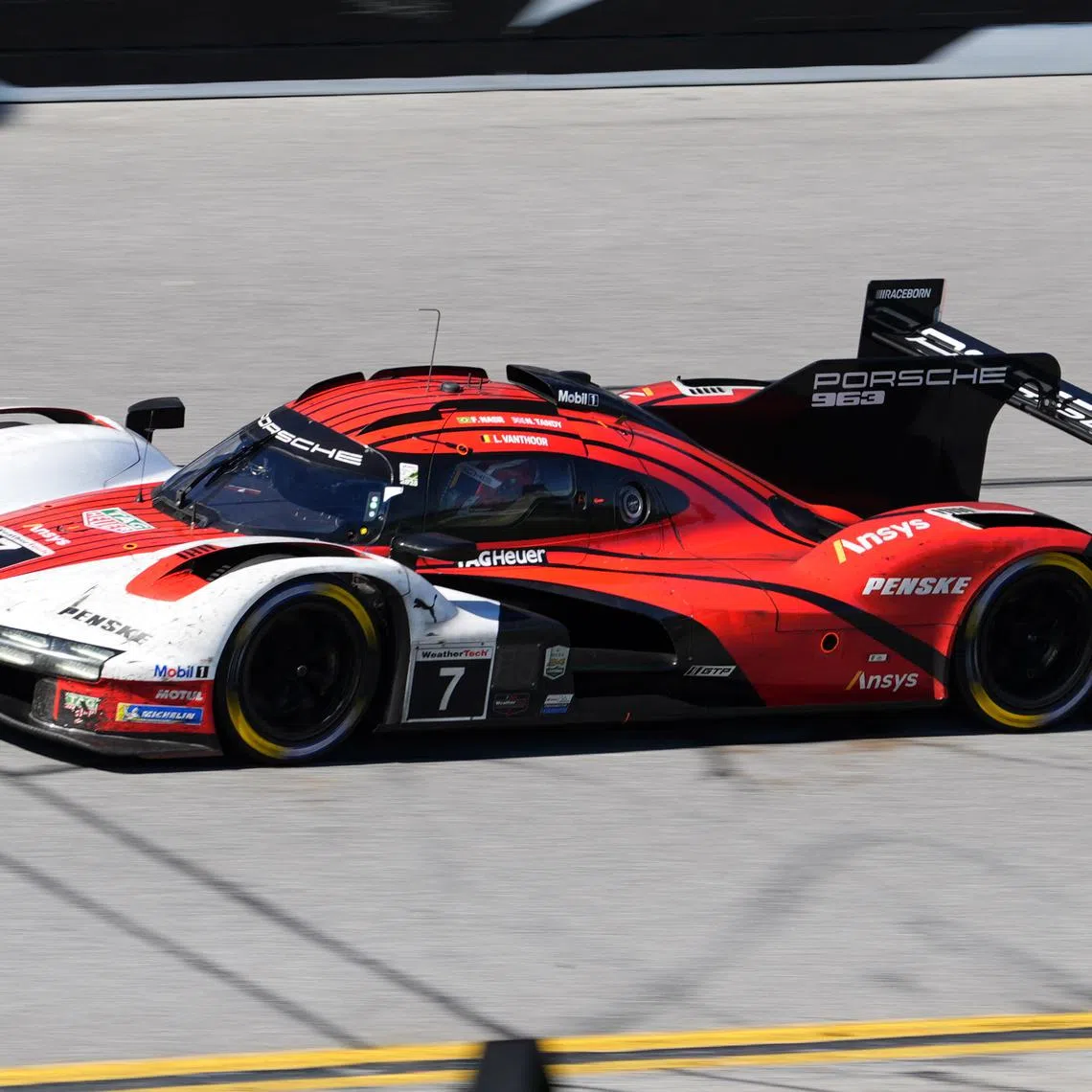 FILE PHOTO: Jan 26, 2025; Daytona Beach, FL, USA; Porsche Penske Motorsport Porsche 963 of Nick Tandy, Laurens Vanthoor, and  Felipe Nasr (7) races during the Rolex 24 at Daytona International Speedway. Mandatory Credit: Jasen Vinlove-Imagn Images/File Photo