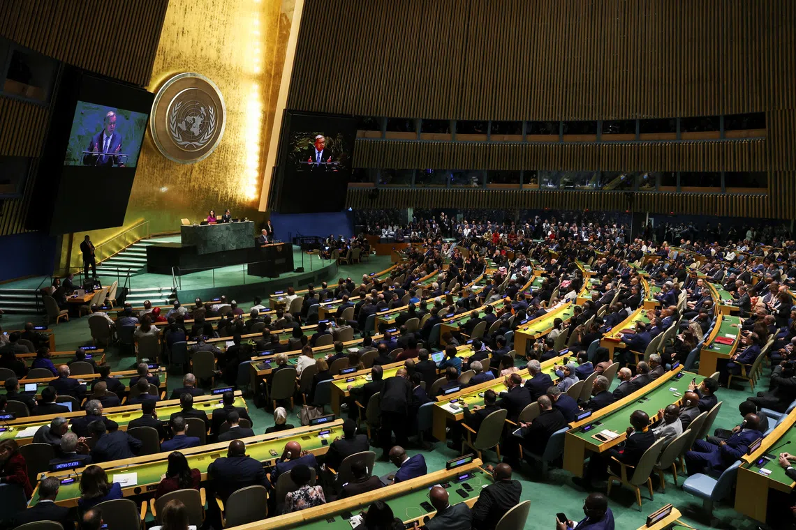 FILE PHOTO: United Nations delegates watch as UN Secretary-General Antonio Guterres addresses the 80th General Assembly at UN headquarters in New York City, U.S., September 23, 2025. REUTERS/Shannon Stapleton/File Photo