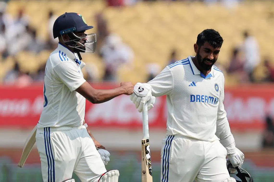 Cricket - Third Test - India v England - Niranjan Shah Stadium, Rajkot, India - February 16, 2024 India's Jasprit Bumrah and Mohammed Siraj walk back to the pavilion after the end of innings REUTERS/Amit Dave