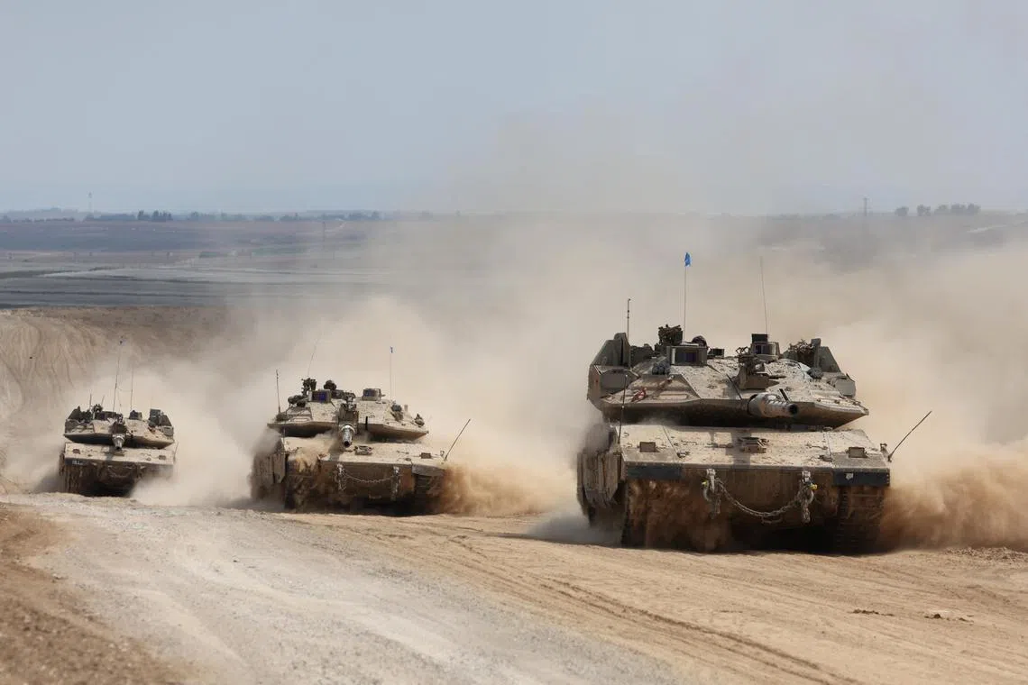 A convoy of Israeli tanks heads to Jabalia, in northern Gaza, where the Israeli military claims Hamas is trying to regroup.