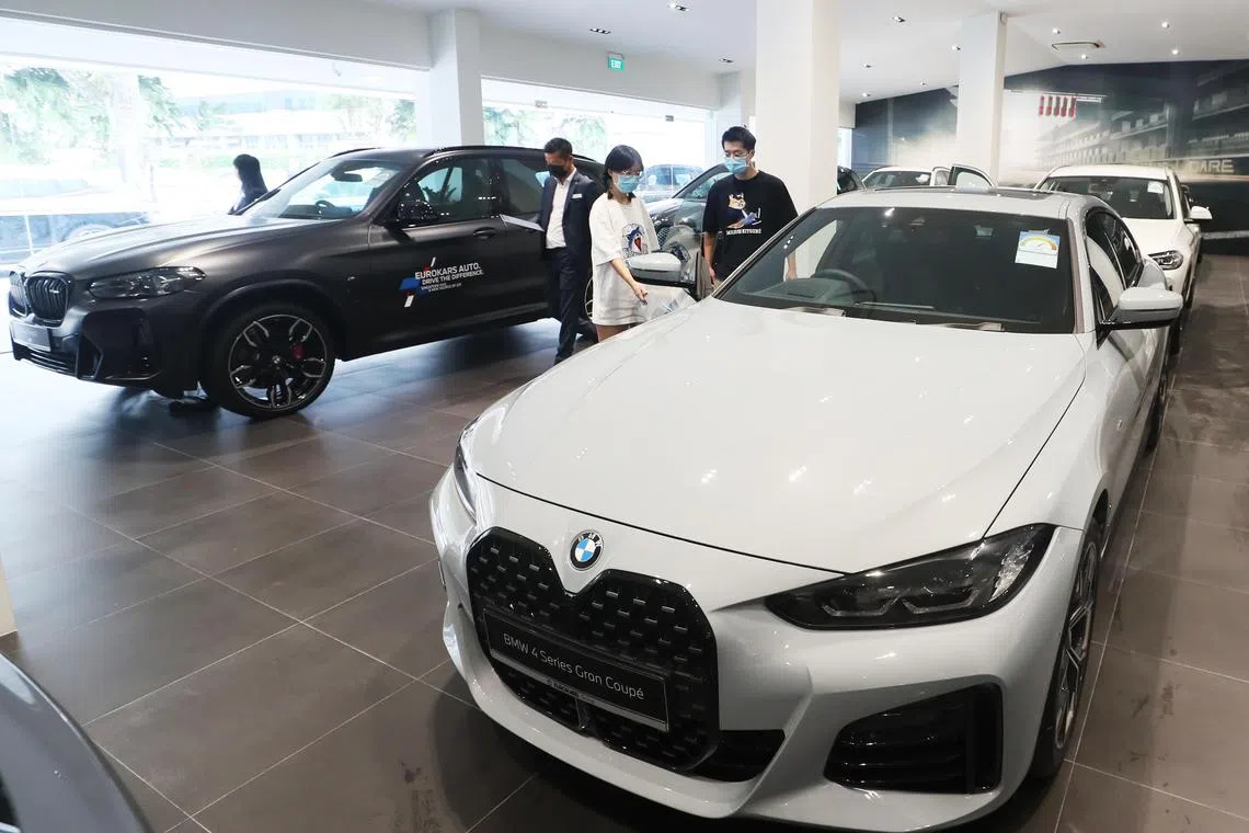 Generic of car showroom and potential customers at BMW