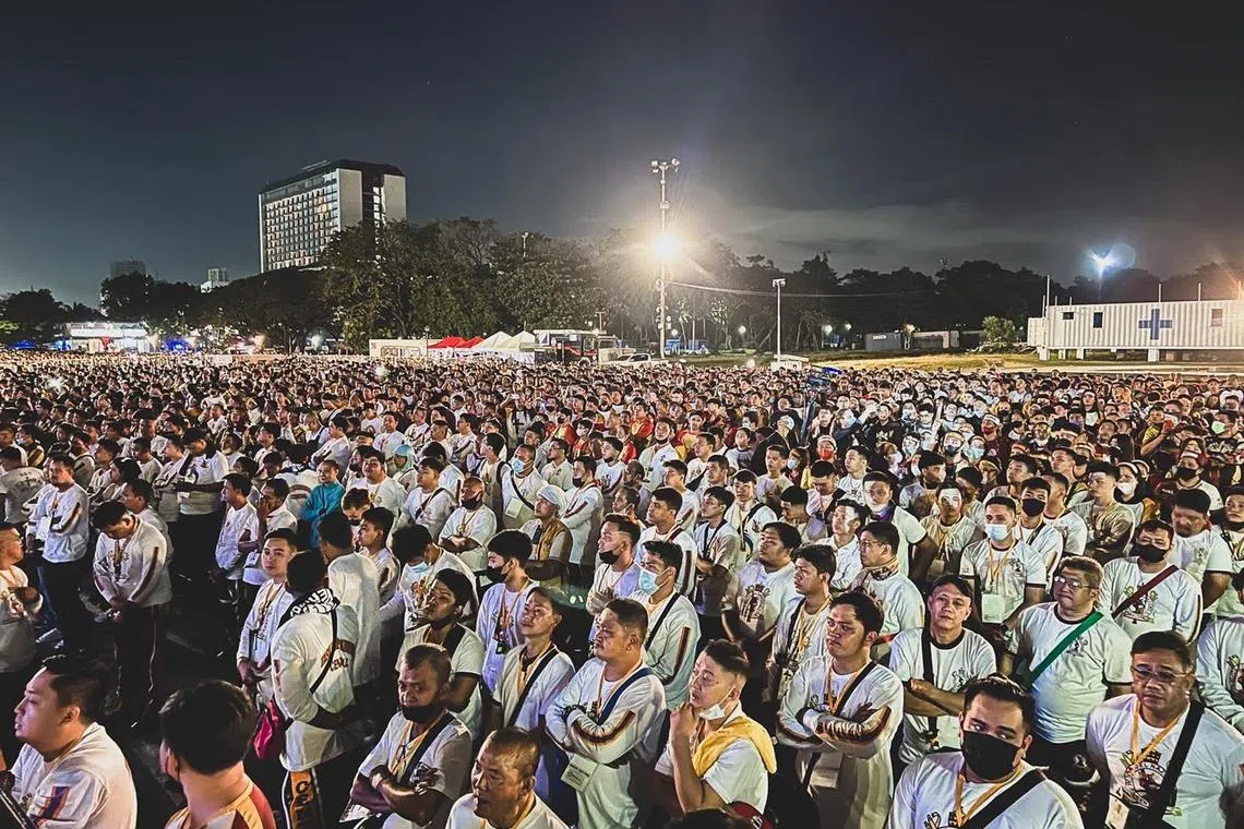 Thousands of devotees follow physical distancing rules while attending the midnight mass for the Black Nazarene Feast in Manila, Philippines, on January 8, 2023.