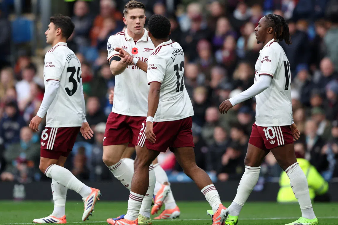 Soccer Football - Premier League - Burnley v Arsenal - Turf Moor, Burnley, Britain - November 1, 2025 Arsenal's Viktor Gyokeres celebrates scoring their first goal with Jurrien Timber REUTERS/Scott Heppell