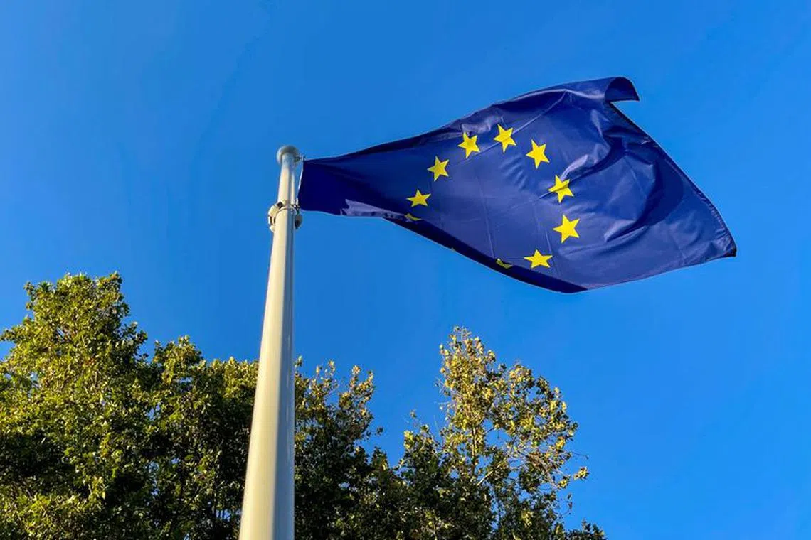 A European Union flag flutters outside the congress palace ahead of the European Political Community summit in Granada, Spain, October 4, 2023. REUTERS/Jon Nazca