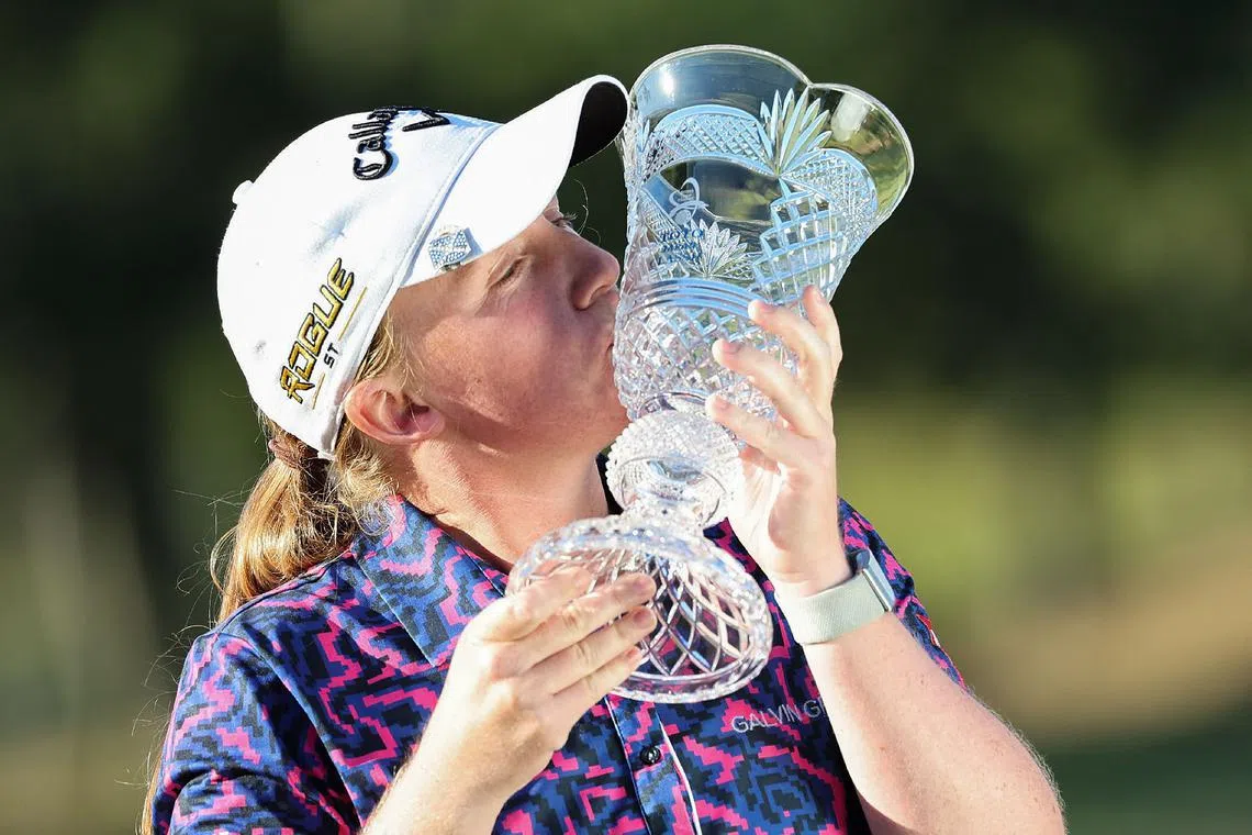 Gemma Dryburgh of Scotland kisses the trophy following her victory on the final day of the LPGA Japan Classic golf tournament in Otsu, Shiga prefecture on November 6, 2022. (Photo by JIJI Press / AFP) / Japan OUT