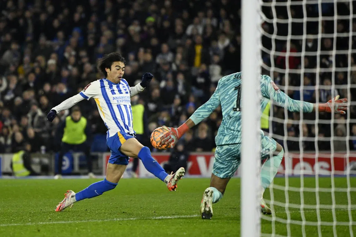 Soccer Football - FA Cup - Fourth Round - Brighton & Hove Albion v Chelsea - The American Express Community Stadium, Brighton, Britain - February 8, 2025 Brighton & Hove Albion's Kaoru Mitoma scores their second goal past Chelsea's Robert Sanchez REUTERS/Tony O Brien