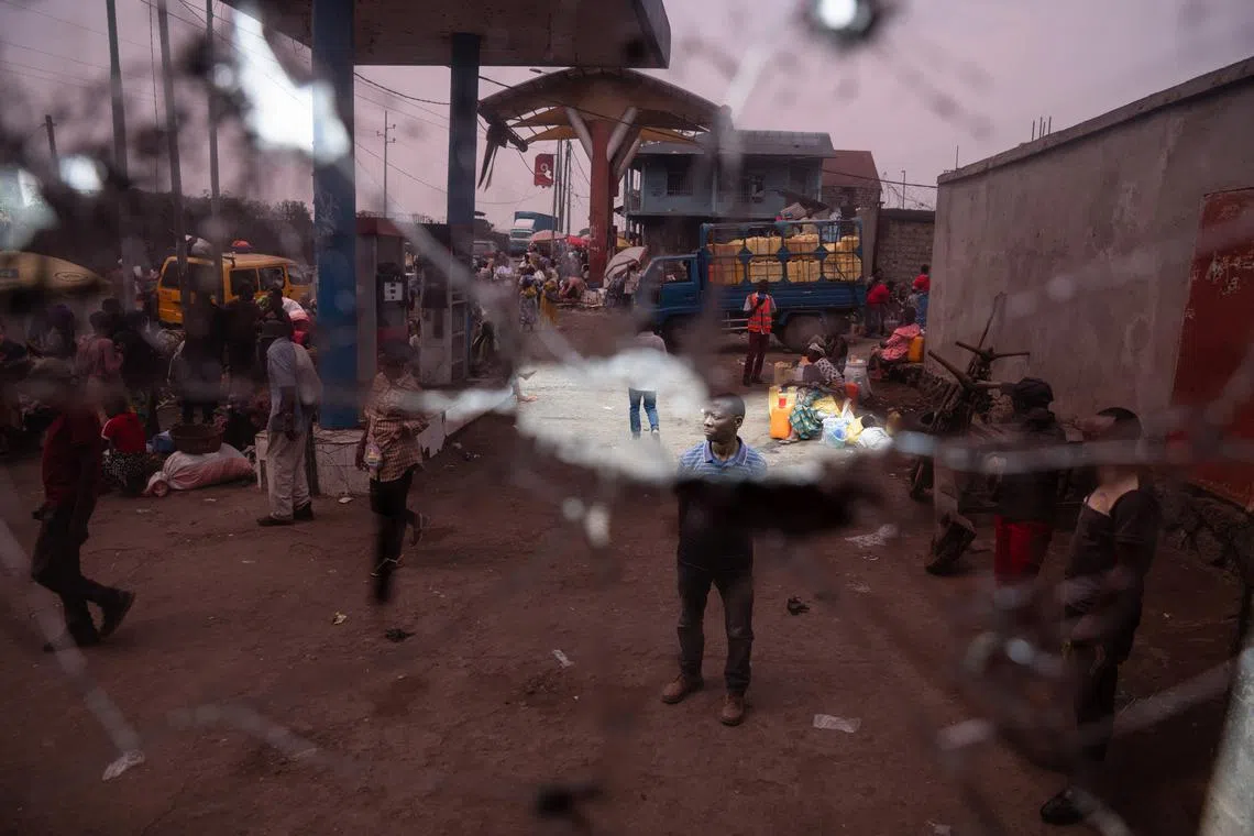 A man stands in front of a gas station office that was hit by light and heavy weapons during the fighting in the town that led to the fall of Goma to the M23 rebels, eastern Democratic Republic of Congo, February 5, 2025. REUTERS/Arlette Bashizi/File Photo