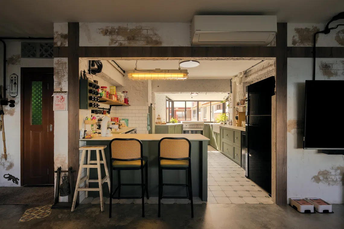 Raw textures and vintage decor create a rustic industrial look in this family's HDB flat.