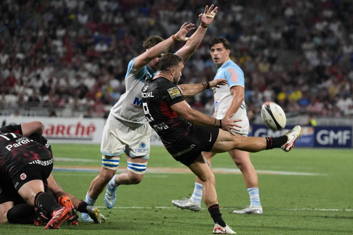Toulouse's French scrum-half Paul Graou kicks the ball in the French Top 14 rugby semi-final against Bayonne in Lyon on June 20, 2025.