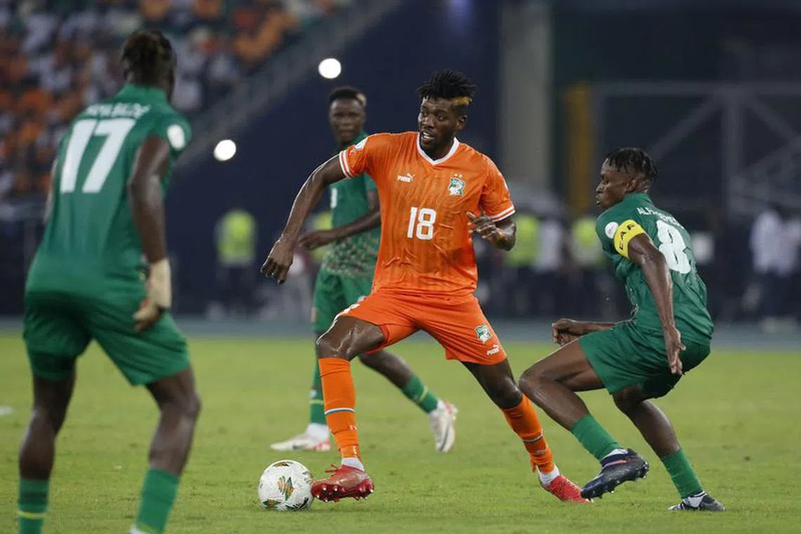 FILE PHOTO: Soccer Football - Africa Cup of Nations - Group A - Ivory Coast v Guinea-Bissau - Olympic Stadium of Ebimpe, Abidjan, Ivory Coast - January 13, 2024 Ivory Coast's Ibrahim Sangare in action with Guinea-Bissau's Alfa Semedo REUTERS/Luc Gnago/File Photo
