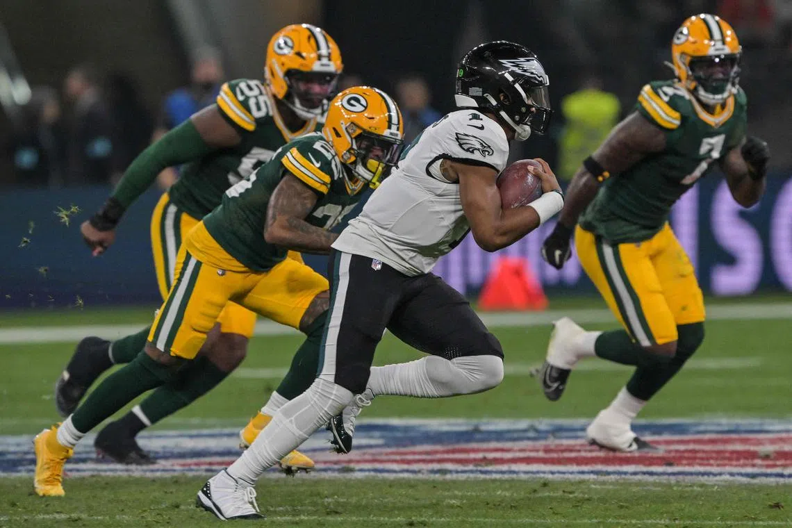Philadelphia Eagles Jalen Hurts runs through with the ball during the NFL game between the Green Bay Packers and Philadelphia Eagles at the Neo Quimica Arena stadium in Sao Paulo, Brazil.