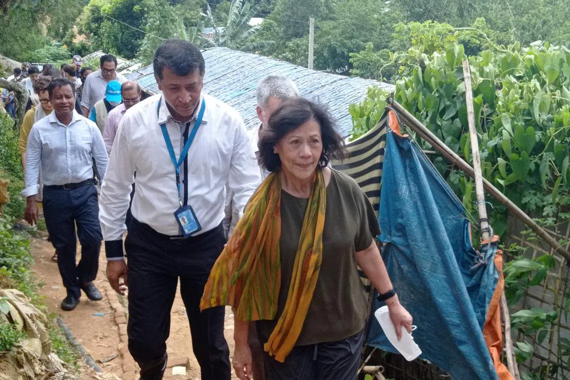 (FILES) United Nations Special Envoy on Myanmar, Noeleen Heyzer (C) visits a Rohingya refugee camp in Ukhia on August 23, 2022. Heyzer will step down, a spokesman for the UN chief told AFP on may 31, 2023, after an 18-month tenure in which she was criticized by the junta and its opponents and with the country in turmoil. "Noeleen Heyzer, Special Envoy of the Secretary-General on Myanmar, will conclude her assignment on 12 June," Stephane Dujarric said, without giving a reason for her departure. (Photo by AFP)