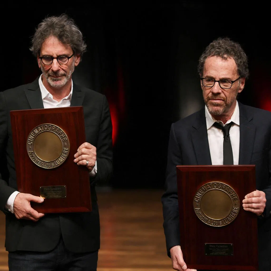 Film-maker brothers Joel (left) and Ethan Coen with their Prix Lumiere 2026 award during the Lumiere Film Festival in Lyon, France, on Oct 16.