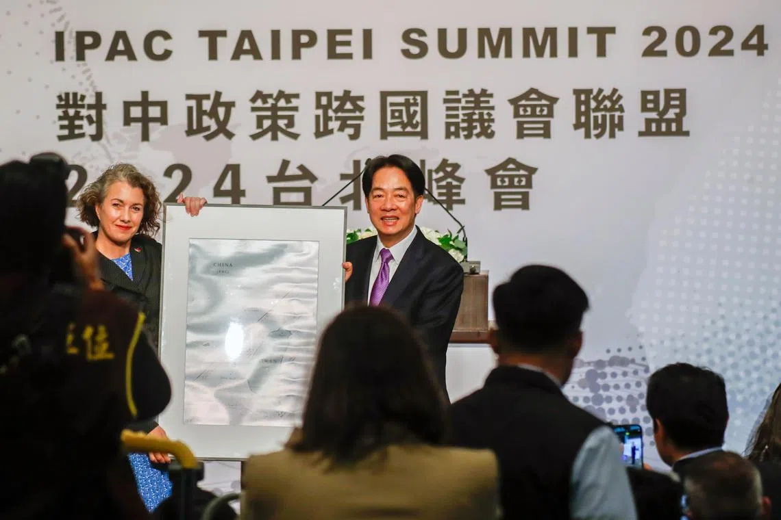 Taiwan president Lai Ching-te (right) receives a map of Taiwan from British MP Sarah Champion at the Inter-Parliamentary Alliance on China (Ipac) summit in Taipei.