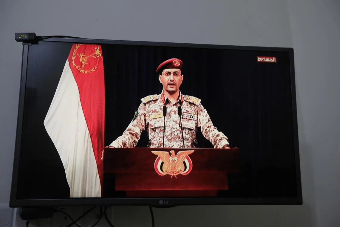 Houthi military spokesman Yahya Sarea delivers a televised statement over a new shipping attack, in Sana'a, Yemen, on April, 27.