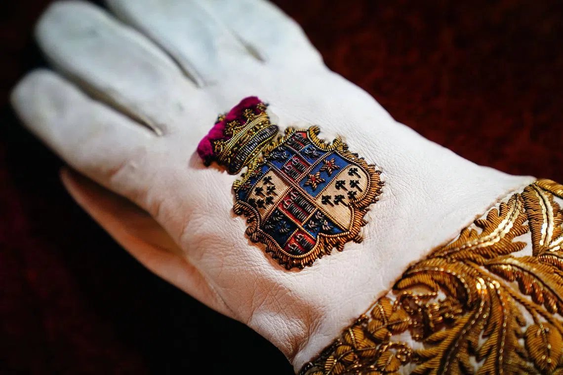 The Coronation Gauntlet glove, which forms part of the Coronation Vestments is displayed in the Throne Room at Buckingham Palace in London on April 26, 2023. -