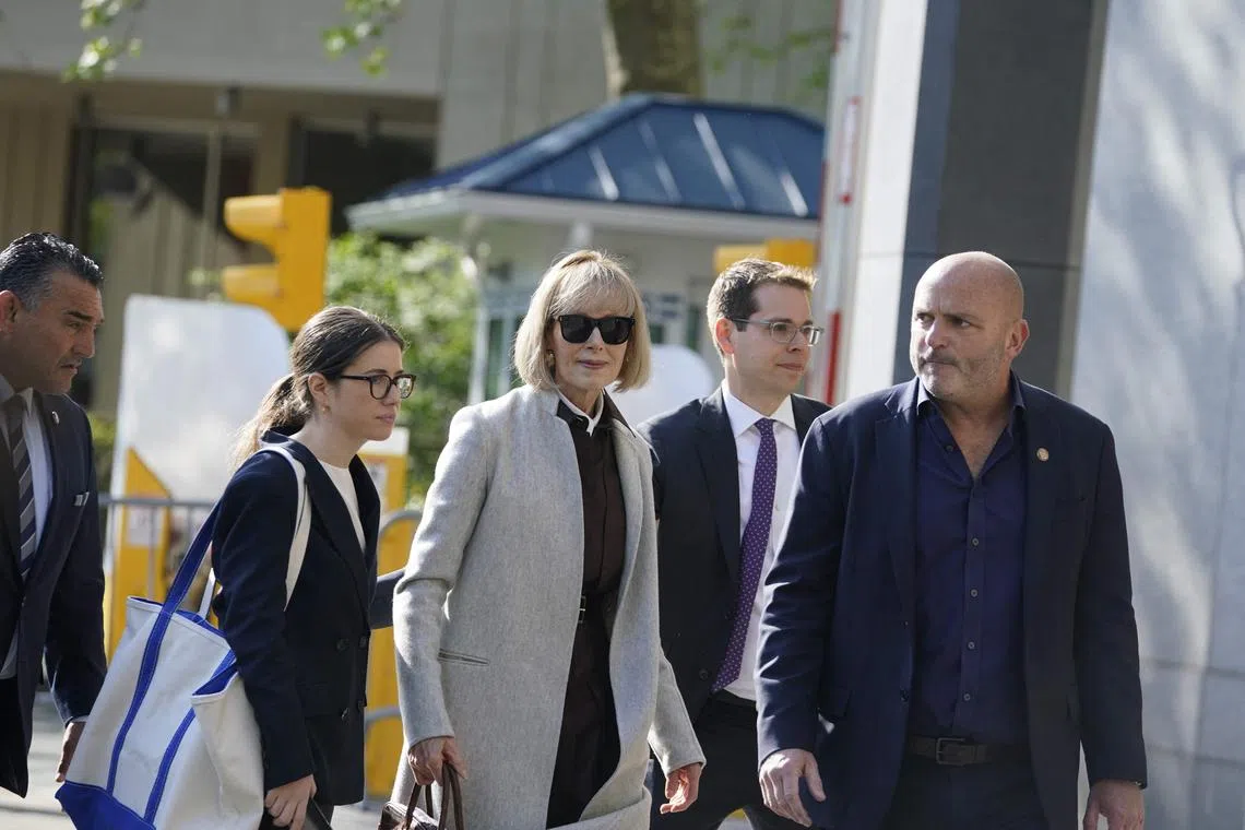 Writer E. Jean Carroll (centre) arriving as jury selection is set to begin in the defamation case against former US president Donald Trump brought by Carroll, who accused him of raping her in the 1990s, at the Manhattan Federal Court, New York, April 25, 2023. (Photo by TIMOTHY A. CLARY / AFP)