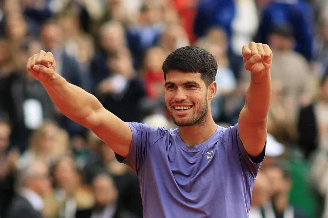 Tennis - ATP Masters 1000 - Monte Carlo Masters - Monte Carlo Country Club, Roquebrune-Cap-Martin, France - April 13, 2025 Spain's Carlos Alcaraz celebrates after winning his final match against Italy's Lorenzo Musetti REUTERS/Manon Cruz
