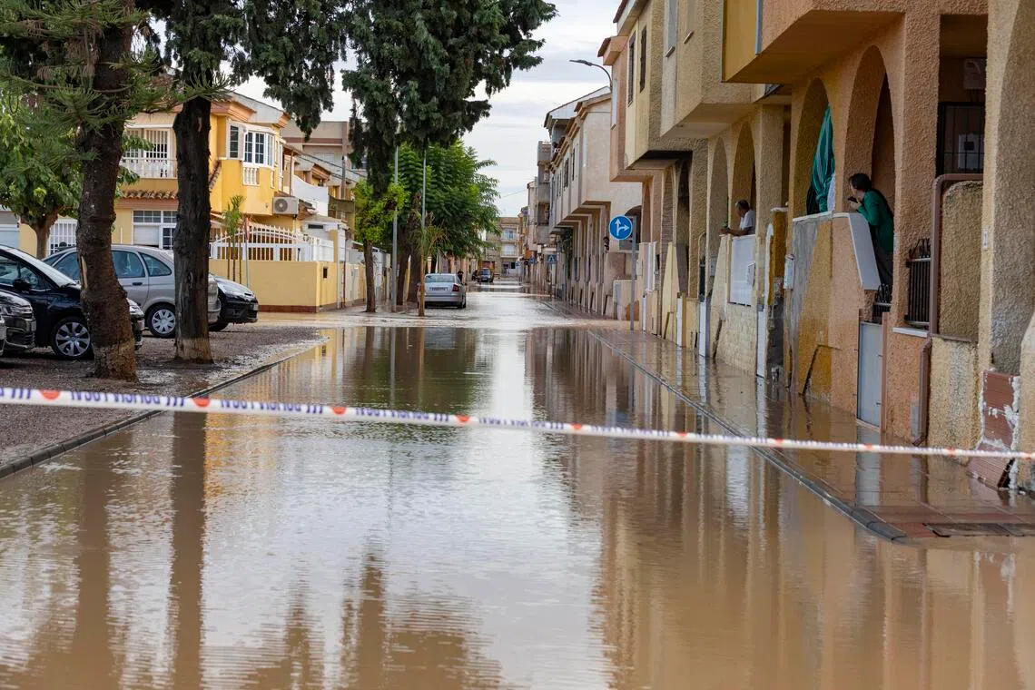 Local media shared videos of roaring torrents of brown water tearing through streets and submerging vehicles.