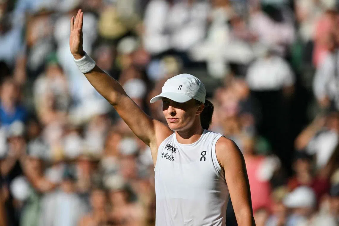 Poland's Iga Swiatek celebrates her victory over Switzerland's Belinda Bencic at the end of their semi-final on July 10.