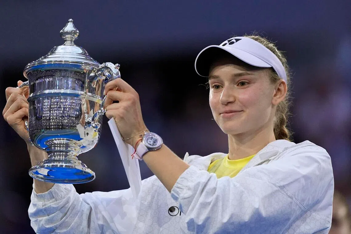 Elena Rybakina celebrates with the trophy after winning the women’s singles final match against Aryna Sabalenka.