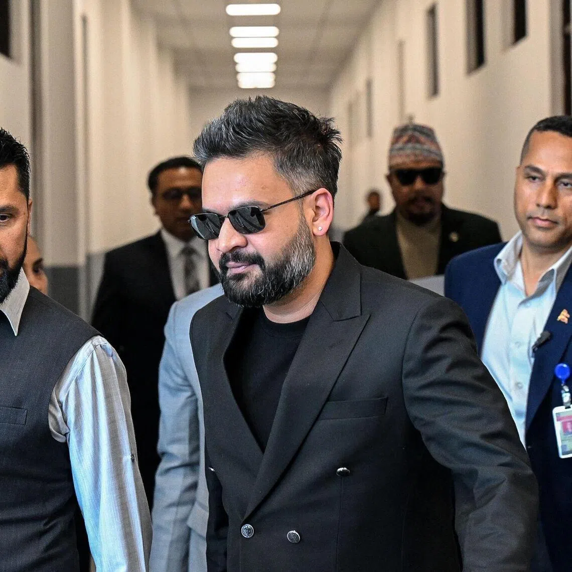 Nepal's Prime Minister Balendra Shah (centre) and Rastriya Swatantra Party president Rabi Lamichhane (left) arrive to attend the April 2 Parliament session in Kathmandu.