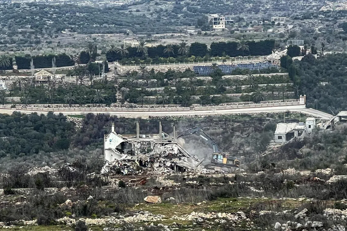 An Israeli military bulldozer works on the Lebanese side of the border between Israel and Lebanon, as seen from Israel, February 17, 2025. REUTERS/ Avi Ohayon