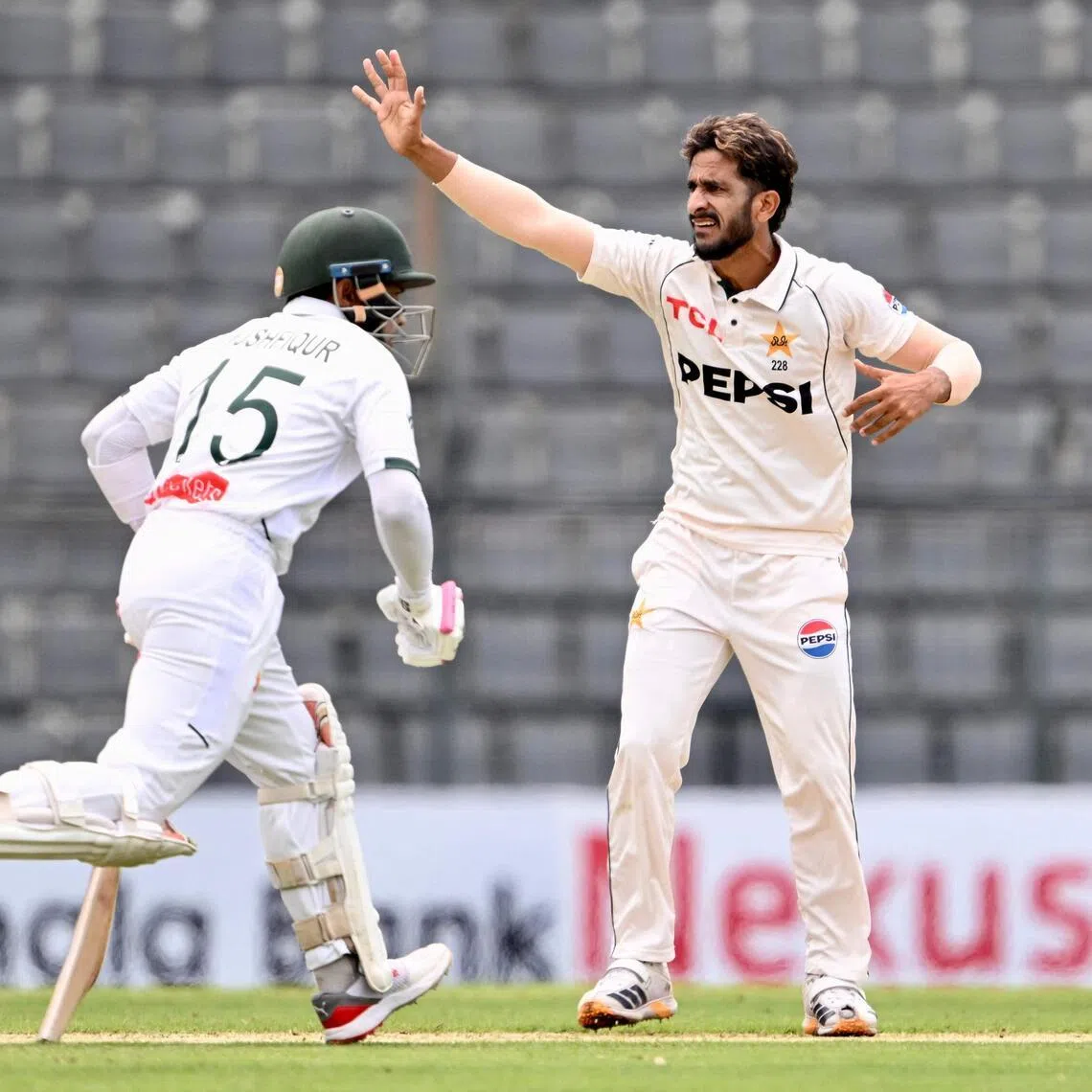 Pakistan’s Hasan Ali gestures as Bangladesh’s Mushfiqur Rahim runs between the wickets on the first day of the second Test at the Sylhet International Cricket Stadium in Sylhet on May 16, 2026. He returned before the end of the morning session after an injury scare.