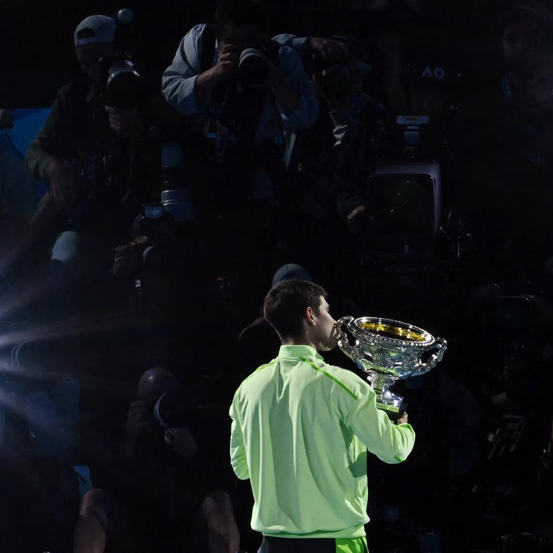 Tennis - Australian Open - Melbourne Park, Melbourne, Australia - February 1, 2026 Spain's Carlos Alcaraz celebrates with the trophy after winning the Australian Open men's singles against Serbia's Novak Djokovic. Alcaraz becomes the youngest man to win all four grand slam titles. REUTERS/Jaimi Joy