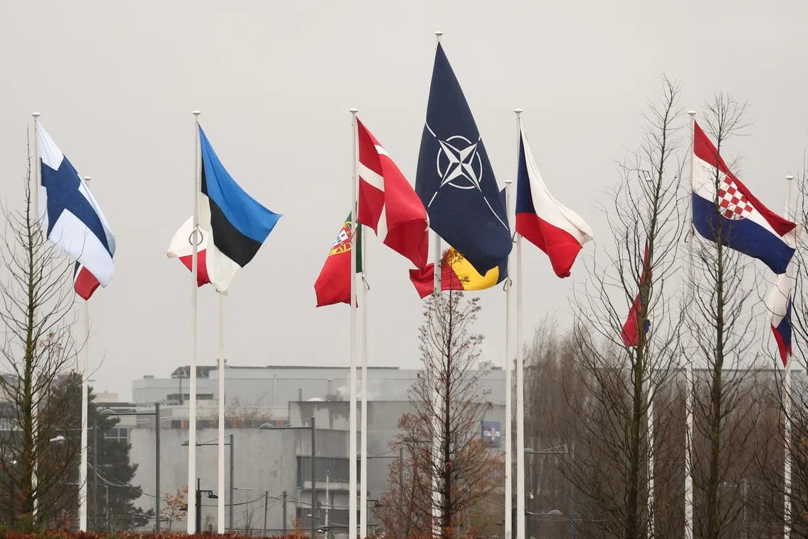 FILE PHOTO: Flags fly outside NATO headquarters, before a meeting of NATO foreign ministers, in Brussels, Belgium November 27, 2023. REUTERS/Yves Herman/FIle Photo