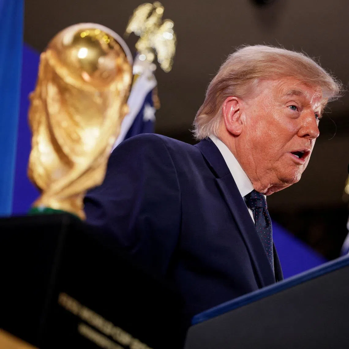 US President Donald Trump speaks while standing next to the FIFA World Cup Trophy in New York City on July 17.