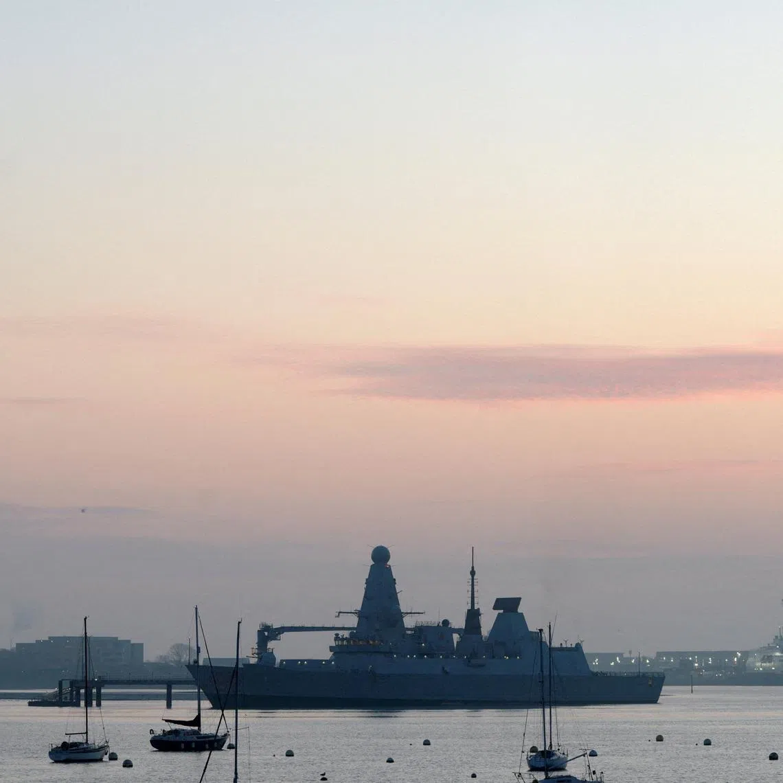 FILE PHOTO: The HMS Dragon during ammunitioning operations at Upper Harbour Ammunitioning Facility (UHAF) in Portsmouth Harbour, after British Prime Minister Keir Starmer announced that Britain would deploy the naval vessel, along with helicopters equipped with counter drone capabilities, to the eastern Mediterranean as the conflict in the Middle East intensifies, in Portsmouth, Britain March 4, 2026. REUTERS/Carlos Jasso/File Photo