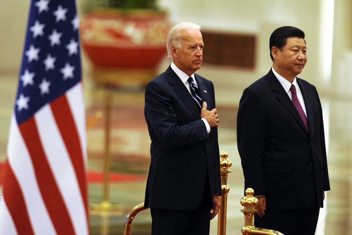 A file photo taken on August 18, 2011 of US President Joe Biden with Chinese Vice President Xi Jinping in Beijing. 