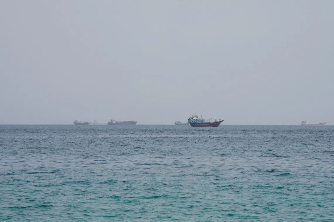 Vessels near the Strait of Hormuz, as seen from Musandam, Oman, August 10, 2026. REUTERS/Stringer