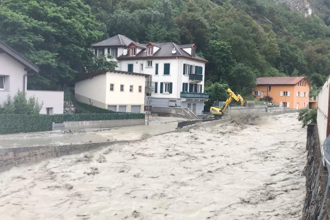 FILE PHOTO: A view of a flood in Chippis, Switzerland, June 21, 2024, in this screengarb obtained from a social media video. X/@ABettmeralp/via REUTERS/File Photo