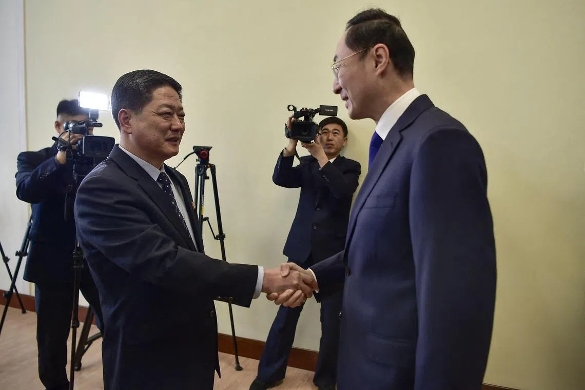 China's Vice Foreign Minister Sun Weidong (R) shakes hands with North Korea's Vice Foreign Minister Pak Myong Ho during a meeting at the People's Palace of Culture in Pyongyang on January 26, 2024. (Photo by KIM Won Jin / AFP)