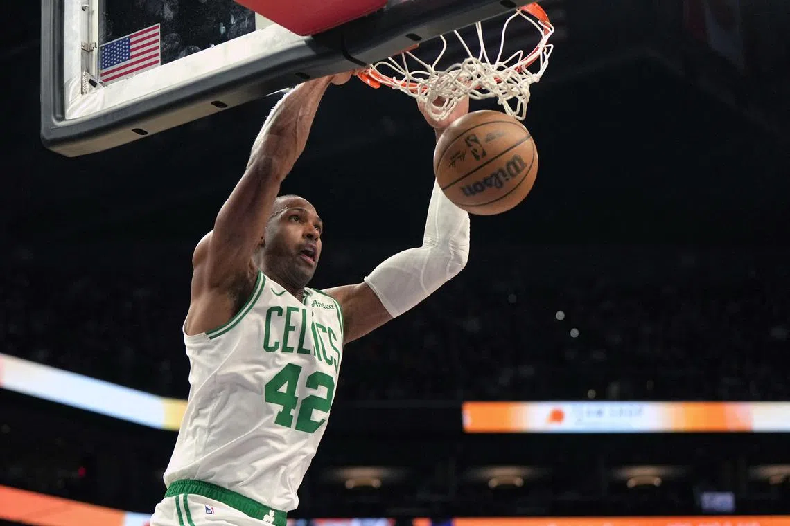 Boston Celtics centre Al Horford dunks against the Phoenix Suns during the second half at Footprint Centre.